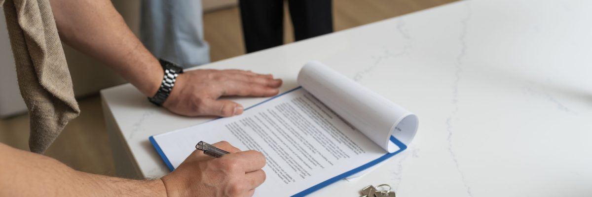 side-view-buyer-signing-document